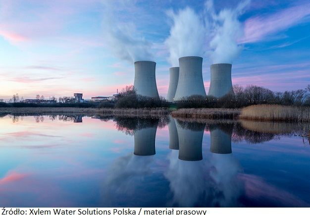 Nuclear power plant after sunset. Dusk landscape with big chimneys