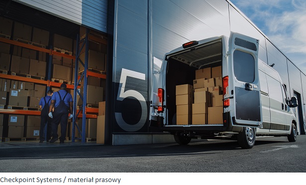 Outside of Logistics Distributions Warehouse: Two Workers Load Delivery Truck with Cardboard Boxes, Drive Off to Deliver Online Orders, Purchases, E-Commerce Goods.